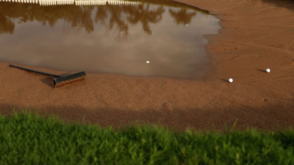 my-club-touched-the-sand-in-a-bunker-when-i-was-measuring-my-relief-area.-is-that-a-penalty?
